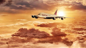 Qatar Airways Flying Through The Sunset Wallpaper