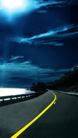 Qhd Coastal Road At Night Wallpaper