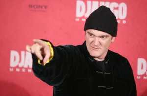 Quentin Tarantino Pointingat Event Wallpaper