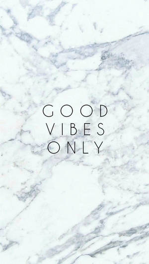 Quotation On Positivity Against White Marble Wallpaper