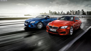 Race Between Red And Blue Bmw Wallpaper