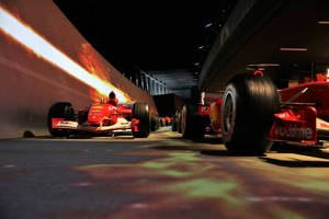 Race Cars In Garage Wallpaper