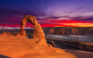 Radiant Sunset Over Arches National Park Wallpaper