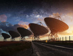 Radio_ Telescopes_ Under_ Starlit_ Sky Wallpaper