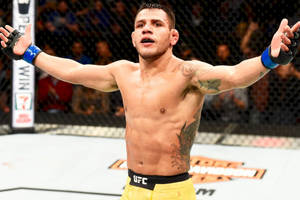 Rafael Dos Anjos Extending Arms Out Wallpaper