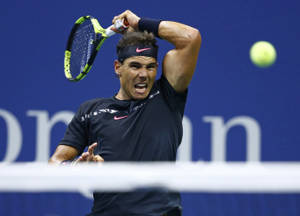 Rafael Nadal Swinging His Racket Wallpaper