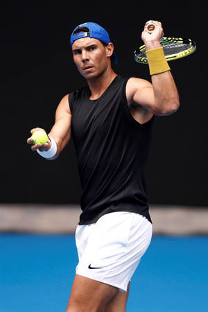 Rafael Nadal With Racket Up Wallpaper