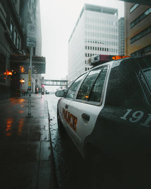 Raining City Police Car Wallpaper