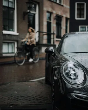 Rainy Day Porschein Urban Setting.jpg Wallpaper