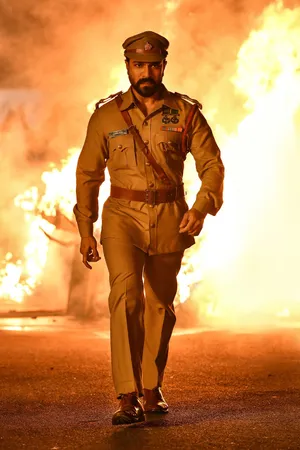 Ram Charan Walking Away From Fire Wallpaper
