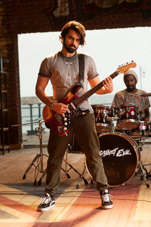 Ram Pothineni With Electric Guitar Wallpaper