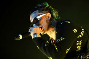 Rap Star Lil Pump Performing On Stage Wallpaper