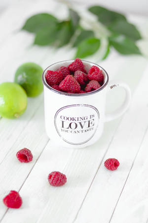 Raspberry Fruits In Mug Wallpaper