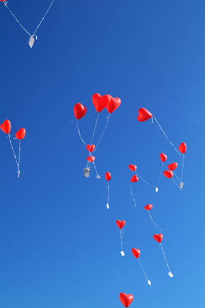 Red Balloons In Sky Wallpaper