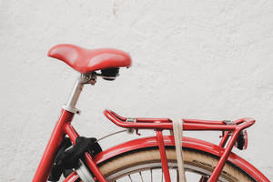 Red Bike On White Wall Wallpaper