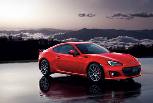 Red Brz On Wet Road Wallpaper