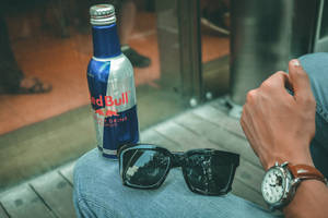 Red Bull Bottle Glasses On Jeans Wallpaper