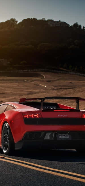 Red Car On Road Lamborghini Phone Wallpaper