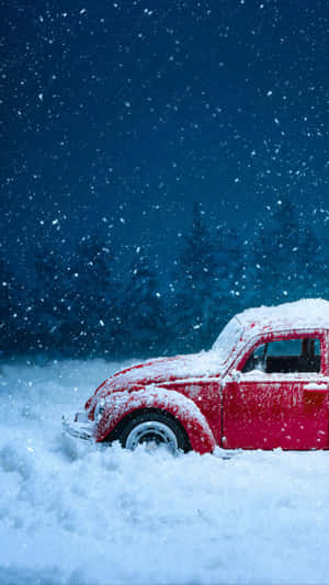 Red Car With Snow Falling Wallpaper