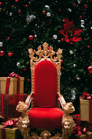 Red Christmas Throne Beside Gifts Wallpaper