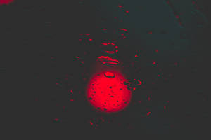 Red Circle With Water Droplets Wallpaper
