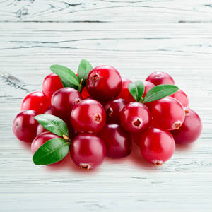 Red Cranberries On Wooden Table Wallpaper