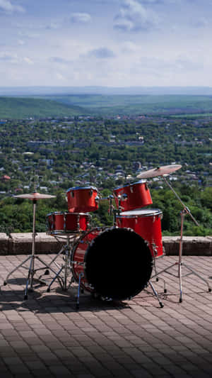 Red Drum Set Outdoor Scenic View Wallpaper