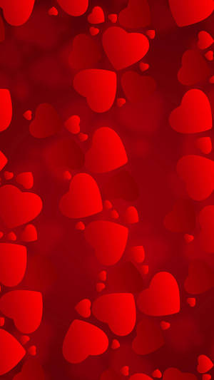 Red Hearts On A Red Background Wallpaper