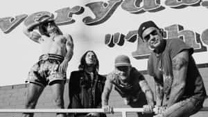 Red Hot Chili Peppers With A Sign Wallpaper