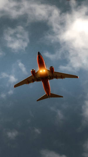 Red Lit Flying Jet Iphone Wallpaper