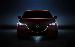 Red Mazda 2 In Darkness Wallpaper