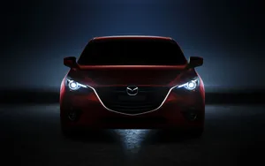 Red Mazda 2 In Darkness Wallpaper