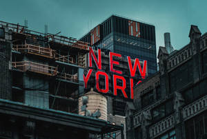 Red Neon Building Sign In Nyc Wallpaper