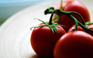 Red Tomato Fruits On Table Wallpaper