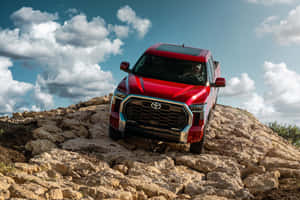 Red Tundra On Rocky Terrain Wallpaper