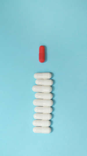 Redand White Capsulewith White Pills Wallpaper