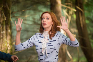 Redheaded Woman Surprised Gesture Forest Background Wallpaper
