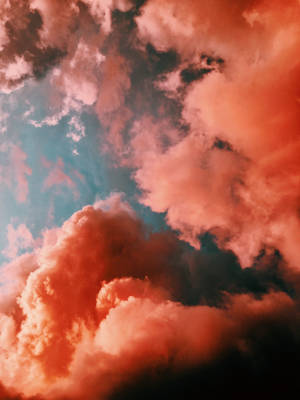 Redmi 4k Orange Clouds Wallpaper