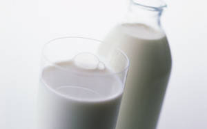 Refreshing Glass And Bottle Of Fresh Dairy Milk Wallpaper