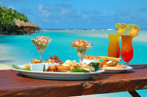 Refreshing Tropical Lunch With Fruity Drinks Wallpaper