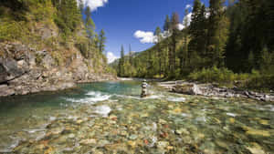 Relax And Enjoy The Peacefulness Of Fly Fishing Wallpaper