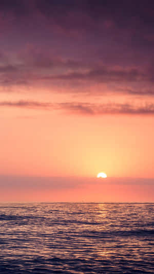 Relaxation And Tranquillity Of The Beach With A Touch Of Sunset Wallpaper