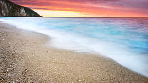 Relaxing Beach Sunset On A Beautiful Evening Wallpaper