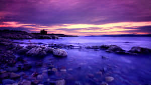 Relish The Vivid Beauty Of A Blue And Purple Sunset Wallpaper