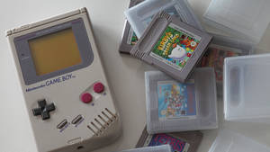 Retro Game Boy With Cartridges Collection Wallpaper