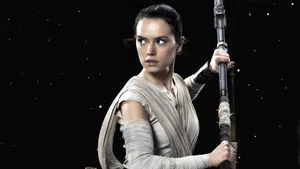 Rey Battles Kylo Ren In An Intense Showdown In Star Wars. Wallpaper