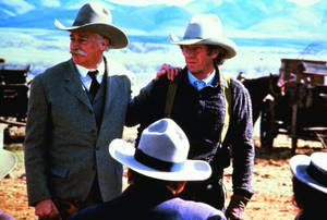 Richard Farnsworth In Cowboy Hat And Suit Wallpaper