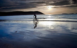 Riding Bicycle On Water Wallpaper