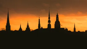 Riga's Steeples On A Sunset Wallpaper