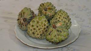 Ripe Cherimoya Plant On Plate Wallpaper